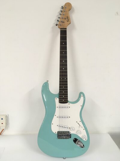 A Fender Squier Bullet Strat electric guitar in sonic blue. Comes with soft carry case.