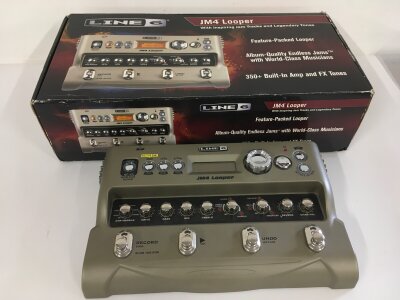 A boxed Line 6 JM4 looper multi pedal with manual and power lead.