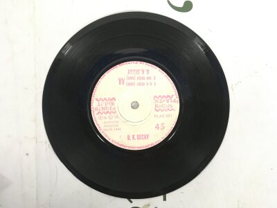 A 1979 split 7" single by UK Decay and Pneumania. Some surface marks and hairline scratches, no cover.