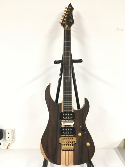 A Raven West electric guitar fitted with two Seymour Duncan humbucker pickups and a single coil DiMarzio pickup. Comes with soft carry case.