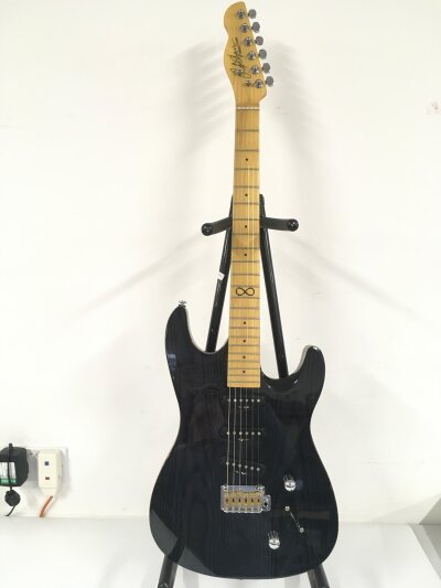 A Chapman ML1 electric guitar. Comes with a soft carry case.