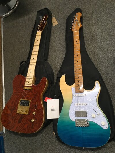 Two electric guitars comprising a Jet Stratocaster style example and a Cozart telecaster style guitar. Both with soft carry cases.
