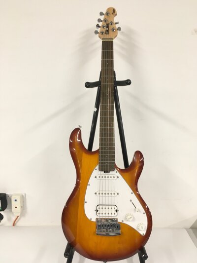A Cort Sub series electric guitar. Comes with soft carry case.