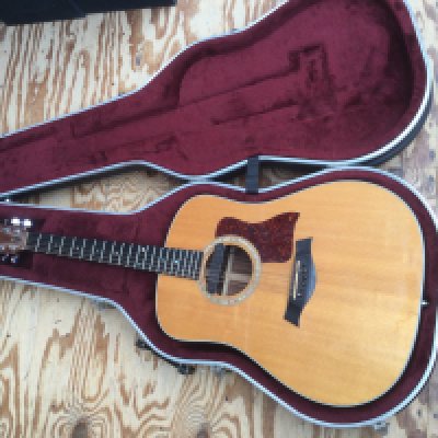 A Taylor 710 acoustic guitar fitted with a Fishman pickup. Comes with original hard shell Taylor branded case.