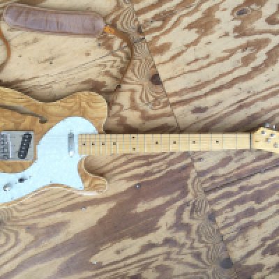 A thinline Telecaster type electric guitar. No maker's name. Comes with a Fender Squier soft carry case.