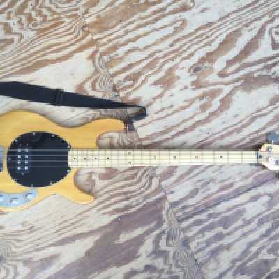 A Vintage Music Man style bass guitar. Comes with soft carry case.