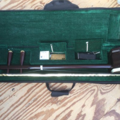 An Erhu, a traditional two stringed Chinese violin, with carry case.