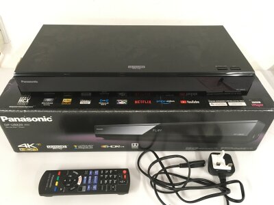 A boxed Panasonic DP-UB820 4K BluRay disc player with remote control and power lead.