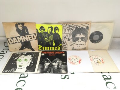 Eight punk 7" singles and EPs by various artists including The Damned, The Stranglers and others.