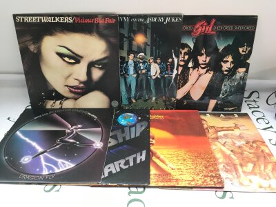 Fourteen rock LPs by various artists including Jefferson Starship, Bad Company, Jim Capaldi and others.