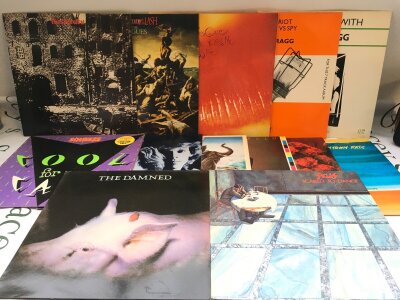 Two bags containing a collection of punk and new wave LPs by various artists including The Stranglers, The Tubes, The Cure and others. Includes demonstration discs.