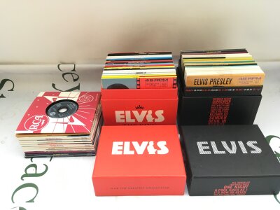 Two Elvis Presley CD box sets plus some other Elvis CDs.