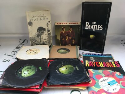 A Beatles CD Stereo box set (incomplete), various 7" singles and EPs and an Elvis Presley Platinum 4CD box set.