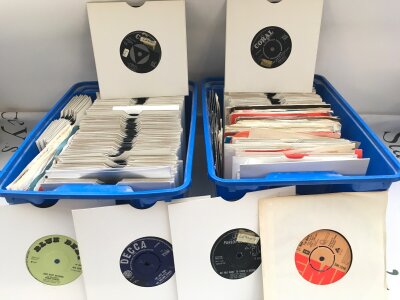 Two small boxes of 7" singles and EPs by various artists from the 1960s onwards.
