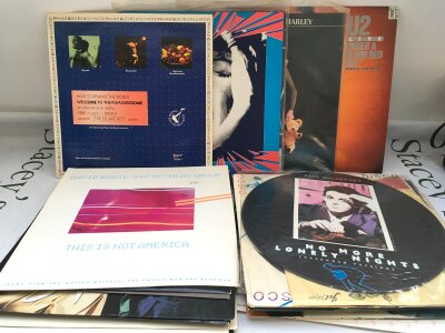 A small collection of 12" singles by various artists including Paul McCartney, David Bowie, Frankie Goes To Hollywood and others.
