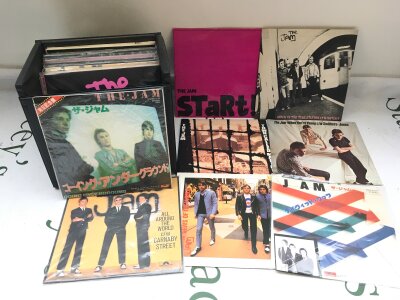 A record case of 7" singles and EPs by The Jam including Japanese imports.