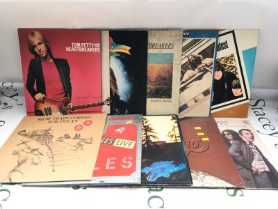 Ten LPs by various artists including The Beatles, Tom Petty, Bob Dylan and others.