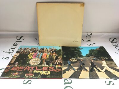 Three early UK pressings of Beatles LPs comprising a numbered White Album 0479315 has poster but no portraits, Sgt Pepper and Abbey Road. All vinyl generally EX/VG+.