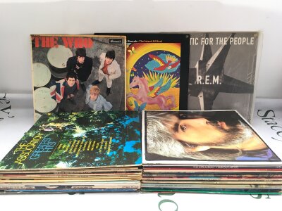 A collection of LPs by various artists including The Who, REM, The Rascals and others.