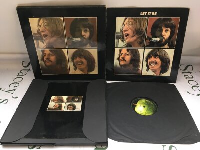 A first UK pressing of The Beatles Let It Be LP complete with outer slipcase, tray and Get Back book. Vinyl EX, cover and sleeve VG, tray G, book EX.
