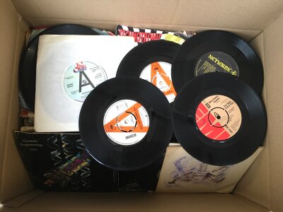 A box of 7" singles by various artists from the 1960s onwards including some promo discs.