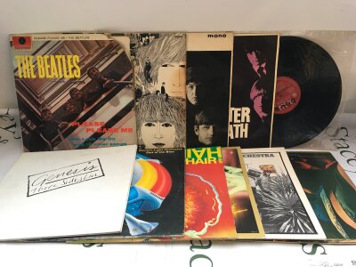 Eleven LPs by various artists including The Beatles, Rolling Stones, ELO and others.