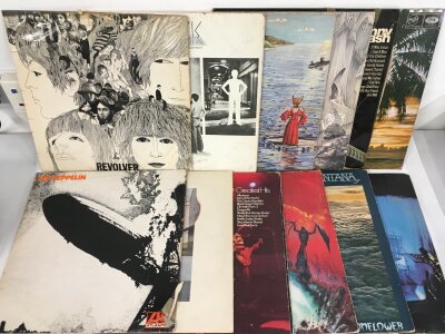 Twelve LPs by various artists including The Beatles, Led Zeppelin, Pink Floyd and others.