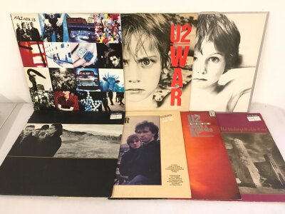Seven U2 LPs comprising War, Achtung Baby, October and others.