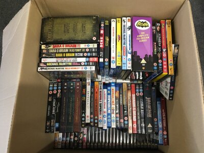 Three large boxes of DVDs and BluRays.