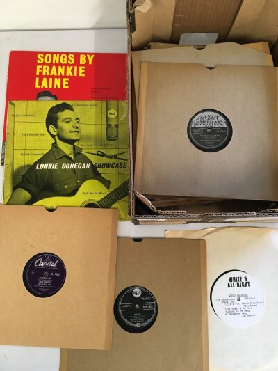 A box of 78s and 10" records by various artists including Gene Vincent, Elvis Presley and others.