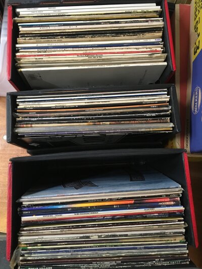 Three record cases of LPs and 12" singles by various artists including Queen, Small Faces, Chris Rea and others including some Bananarama promo discs.