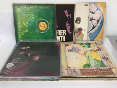 A collection of LPs by various artists including The Rolling Stones, Alice Cooper, Fleetwood Mac and others.
