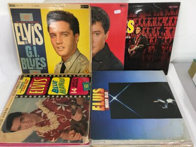 Twenty Elvis Presley LPs comprising G.I. Blues, Blue Hawaii and others. Plus 30 Elvis books mostly hard books