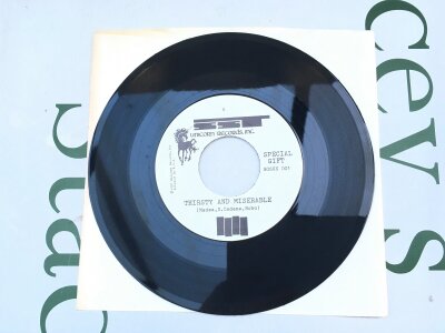 Black Flag. A limited edition 7" promo of Thirsty & Miserable / Life Of Pain. One of 700 pressed and given away to customers who purchased a Black Flag ticket at Licorice Pizza record stores.