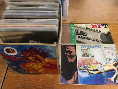 A box of LPs by various artists including Jimi Hendrix, Marc Bolan, Patti Smith Group and others.