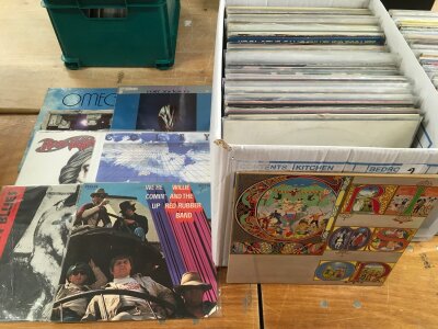 A box of LPs by various artists including King Crimson, Omega, Milt Jackson and others.