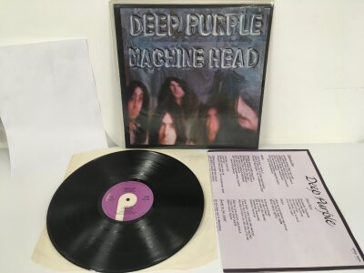A 1972 first UK pressing of the Deep Purple LP Machine Head complete with lyric poster insert and Gramophone Co label credit. Vinyl EX.