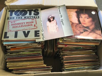 Two boxes of 7" singles by various artists including Kate Bush, The Who, David Bowie and many more,