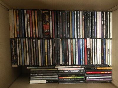 Four boxes of CDs by various artists including Arctic Monkeys, Paul Weller, Madonna, The Who and many more.