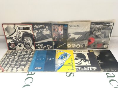 Ten punk 7" singles by various artists including Buzzcocks, Stiff Little Fingers, Chaotic Dischord and others.