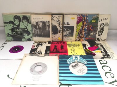 Fifteen punk 7" singles by various artists including Gang Green, Avengers, Pointed Sticks and others.