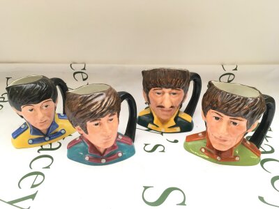 A set of Royal Doulton Beatles character jugs, approx height 14cm.