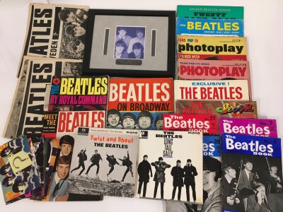 A collection of Beatles ephemera comprising two EPs, Beatles Book Monthly magazines and others plus a framed film cel.