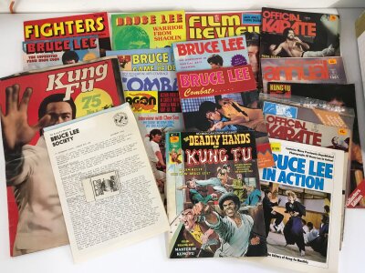 A collection of Bruce Lee / martial arts related ephemera comprising magazines and posters.