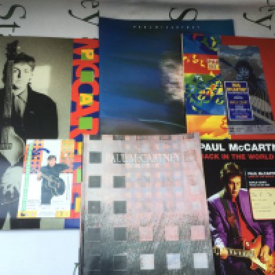 Five Paul McCartney tour programs, three with tickets.