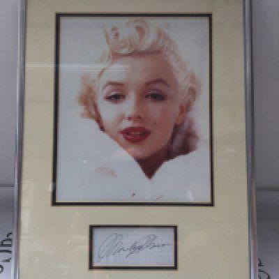 A framed and glazed signed display of Marilyn Monroe with COA, approx 32cm x 42cm.