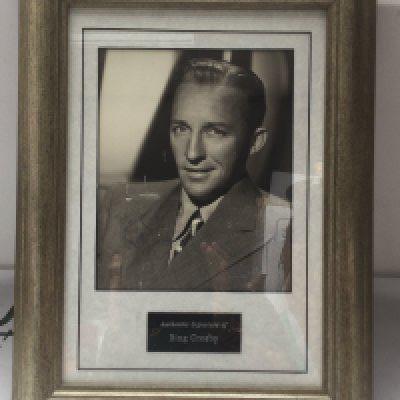 A framed and glazed signed Bing Crosby display with COA, approx 34cm x 45cm.