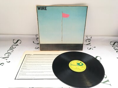 A first UK pressing of the Pink Flag LP by Wire. Vinyl EX.