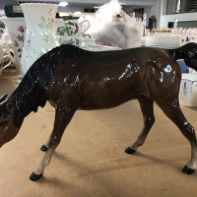 A Royal Doulton horse with its head down. NO RESERVE