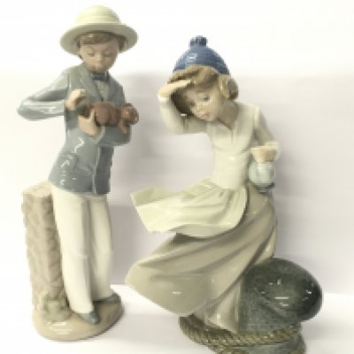 Five Spanish-made ceramic figures, four of which are NAO and one made by Lladro.